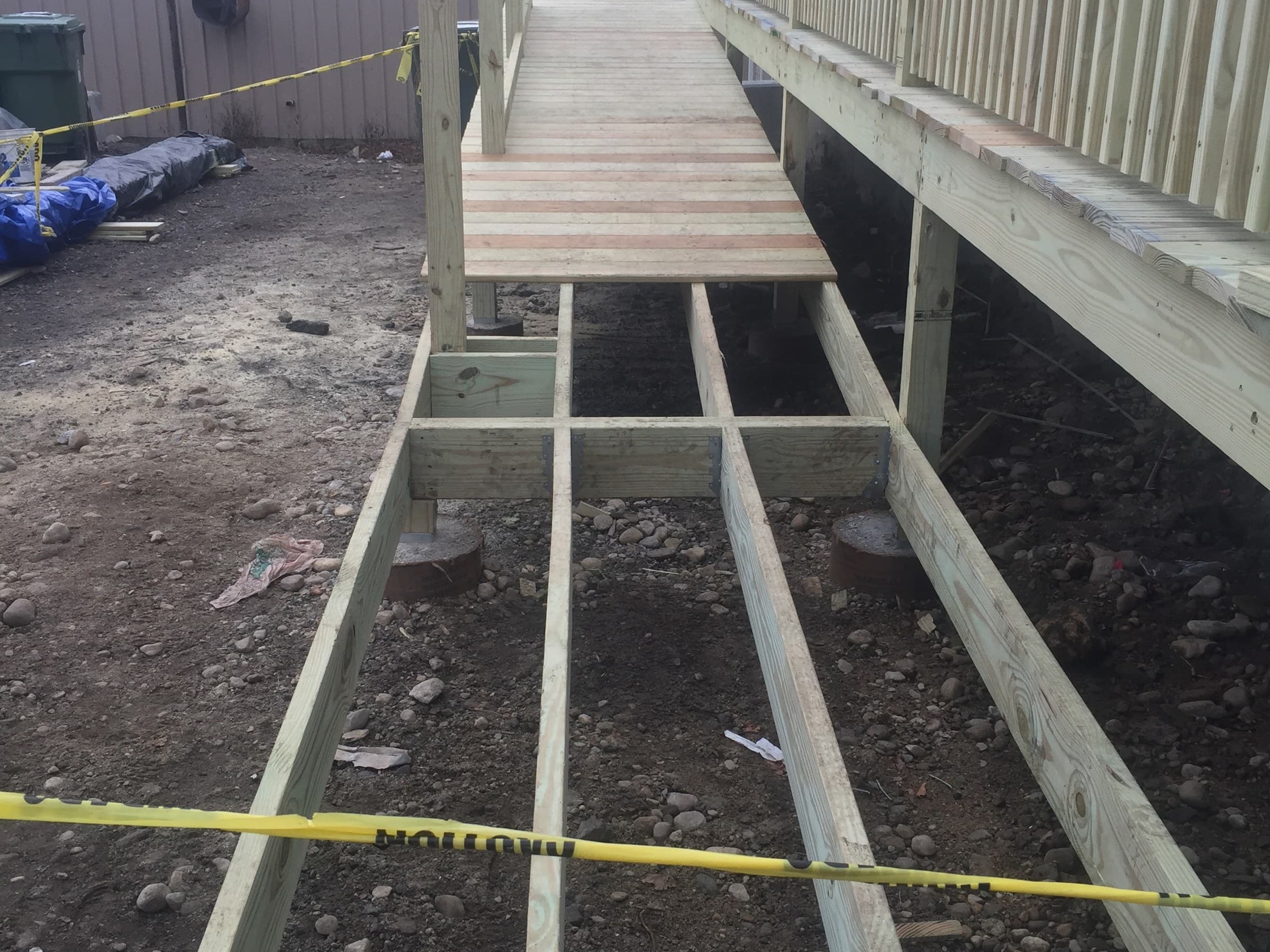 Wooden framing for the entrance ramp during Adonai Outreach Ministry's construction in 2017