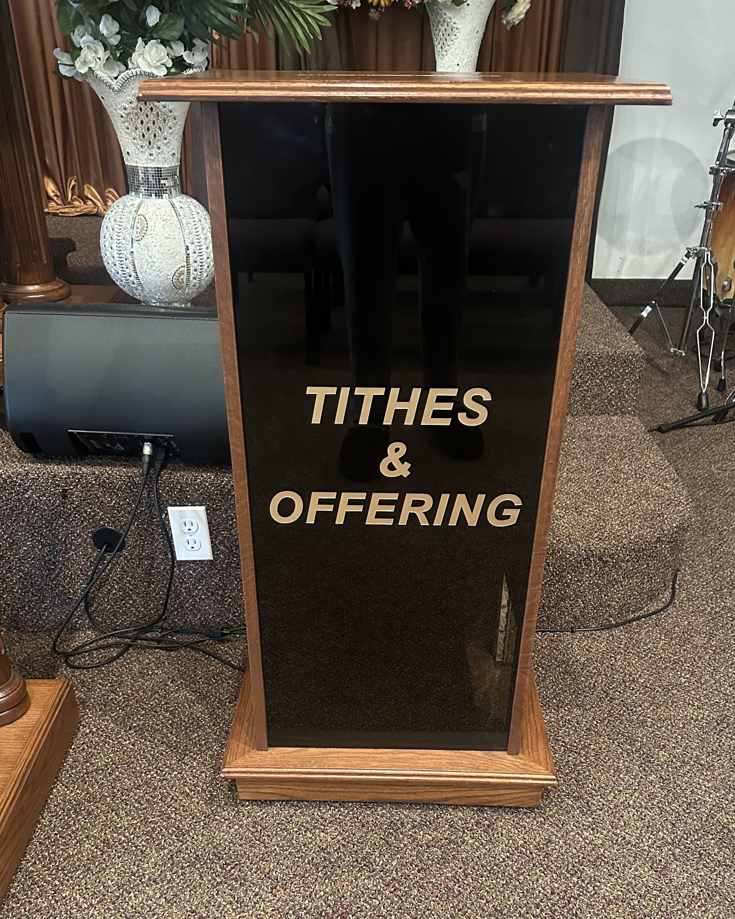 Tithes & Offering bin at the front of the Adonai Outreach Ministry sanctuary